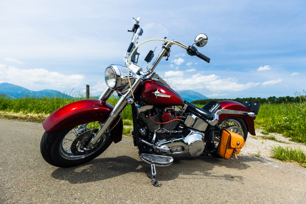 red harley davidson parked on the road on a sunny day in florida