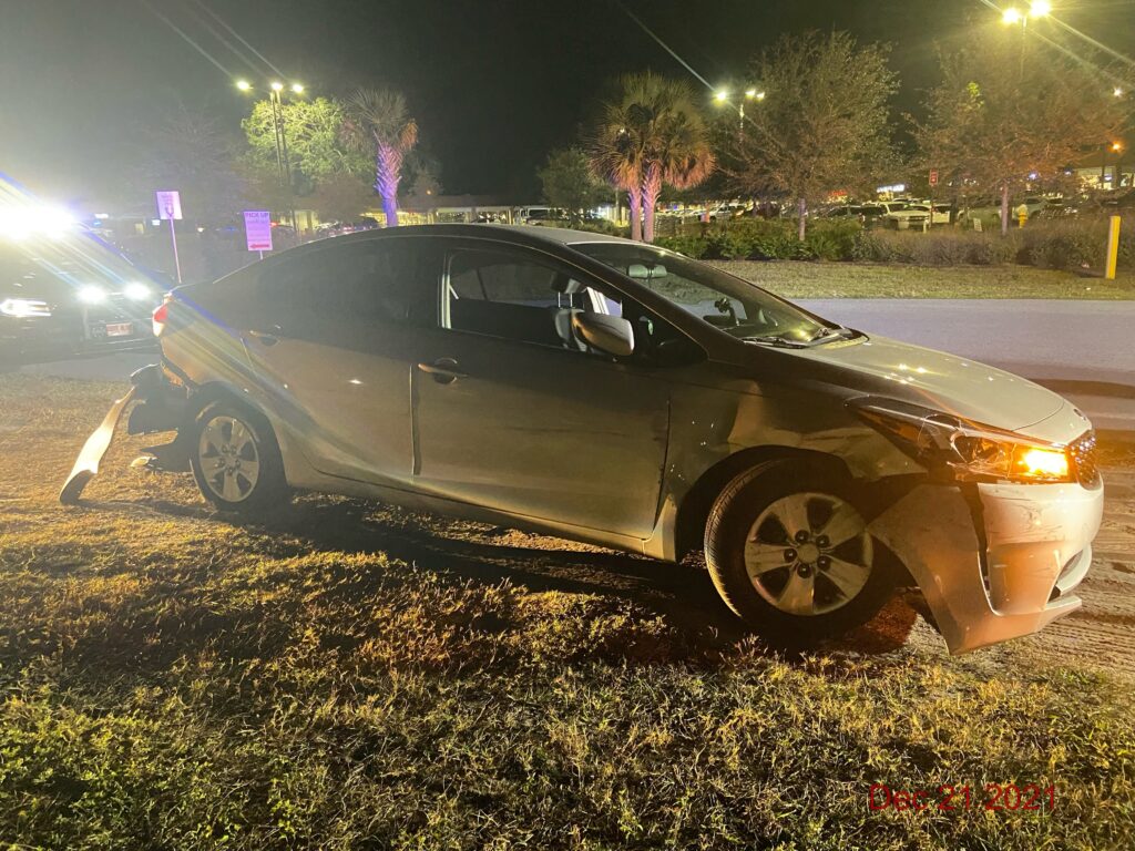 A damaged vehicle on the side of the road after an accident in Florida.